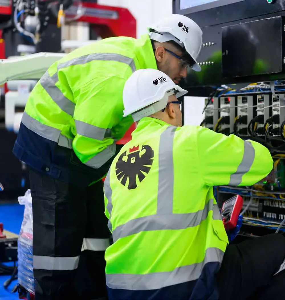 WB MAX technicians at an electrical cabinet