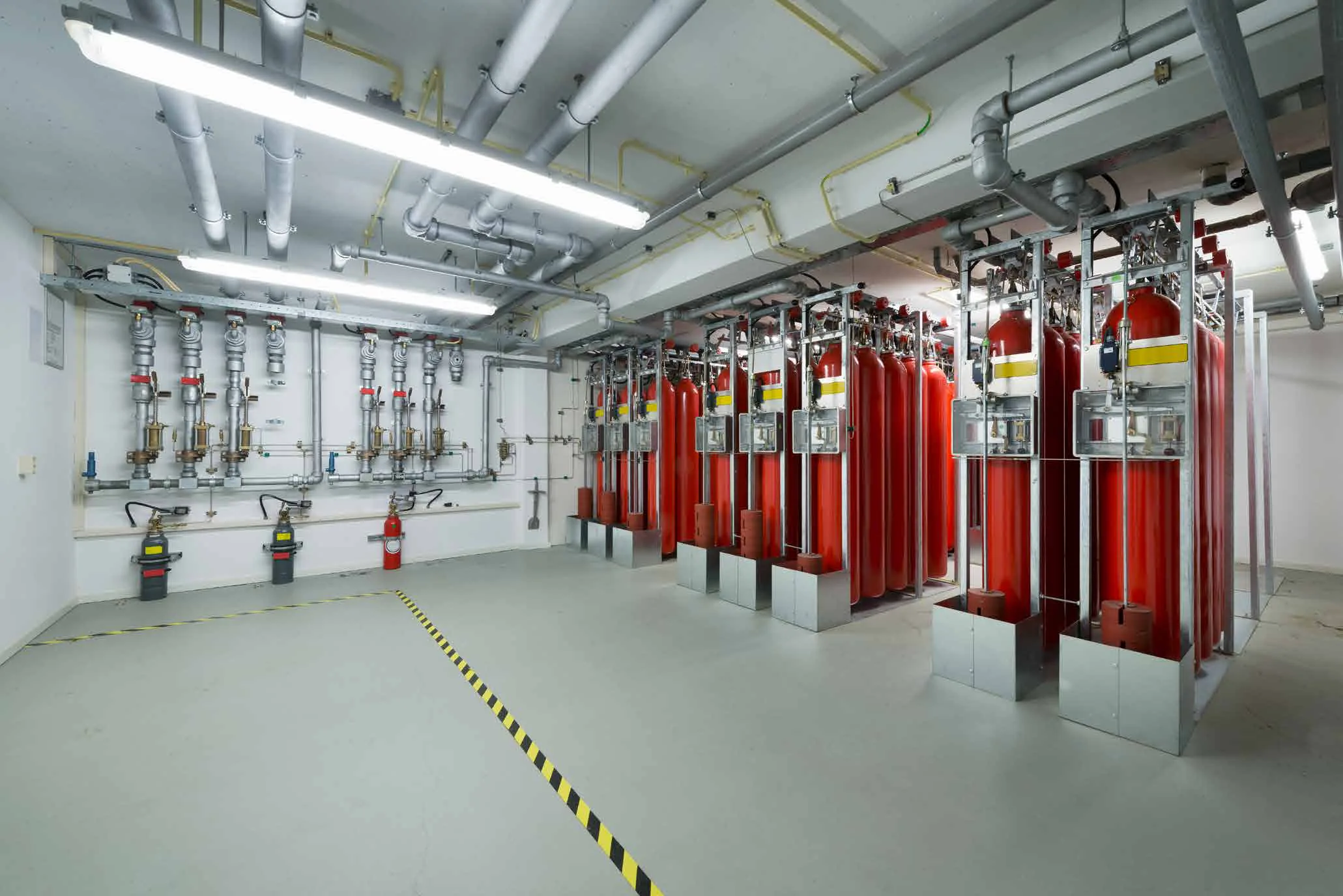 Gas extinguishing plant room with red cylinder banks
